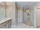 Bathroom featuring a single sink vanity and glass enclosed shower at 5980 Whitestone Ln, Suwanee, GA 30024