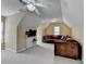 Lofted bonus room featuring a ceiling fan, windows, TV, and sofa seating at 5980 Whitestone Ln, Suwanee, GA 30024
