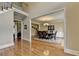 Elegant dining room with hardwood floors, a chandelier, and space for Gathering gatherings at 5980 Whitestone Ln, Suwanee, GA 30024