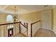 Foyer with chandelier and stairs with view of front door at 5980 Whitestone Ln, Suwanee, GA 30024