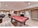 Large game room complete with a pool table and plenty of space for entertaining at 5980 Whitestone Ln, Suwanee, GA 30024