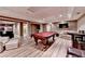 Relaxing game room boasts a pool table and comfortable seating at 5980 Whitestone Ln, Suwanee, GA 30024