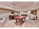 Spacious game room featuring a pool table, seating area and recessed lighting at 5980 Whitestone Ln, Suwanee, GA 30024