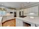Well-appointed kitchen featuring white cabinets, stainless steel appliances, and center island at 5980 Whitestone Ln, Suwanee, GA 30024