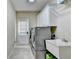 Practical laundry room equipped with modern appliances and ample storage at 5980 Whitestone Ln, Suwanee, GA 30024