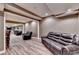 Spacious living area that opens to the game room and bar at 5980 Whitestone Ln, Suwanee, GA 30024