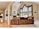 Spacious living room with high ceilings, large windows, fireplace, and pool view at 5980 Whitestone Ln, Suwanee, GA 30024