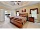 Large main bedroom showing tray ceilings and view of the office at 5980 Whitestone Ln, Suwanee, GA 30024