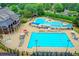 Resort-style pool area featuring an ample seating area and pool with slide for community residents at 5980 Whitestone Ln, Suwanee, GA 30024