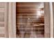 The property has a beautiful indoor sauna with wooden benches and a temperature control panel at 5980 Whitestone Ln, Suwanee, GA 30024