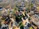 Expansive aerial view of a stately home nestled among mature trees in a well-manicured neighborhood at 971 Ashebrooke Ne Ct, Marietta, GA 30068