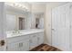 Bathroom with white cabinets, dual sinks, quartz countertop and new fixtures at 971 Ashebrooke Ne Ct, Marietta, GA 30068