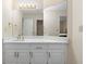 Bathroom with white cabinets, dual sinks, quartz countertop and new fixtures at 971 Ashebrooke Ne Ct, Marietta, GA 30068