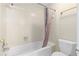 Standard bathroom featuring a white bathtub with shower and matching toilet at 971 Ashebrooke Ne Ct, Marietta, GA 30068