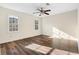 Sun-filled, spacious bedroom features wood-look floors and great natural light from two windows at 971 Ashebrooke Ne Ct, Marietta, GA 30068