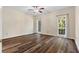 Spacious bedroom with hardwood floors, ceiling fan, and lots of natural light at 971 Ashebrooke Ne Ct, Marietta, GA 30068