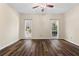 Spacious bedroom with hardwood floors, ceiling fan, and lots of natural light at 971 Ashebrooke Ne Ct, Marietta, GA 30068