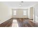 Spacious bedroom featuring hardwood floors, two windows and white trim at 971 Ashebrooke Ne Ct, Marietta, GA 30068