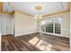 Dining room with decorative chandelier, hardwood floors, and a large window at 971 Ashebrooke Ne Ct, Marietta, GA 30068