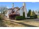Stately home featuring a deck and well-manicured landscaping at 971 Ashebrooke Ne Ct, Marietta, GA 30068
