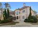 Elegant two-story home featuring lush landscaping and a well-manicured front yard at 971 Ashebrooke Ne Ct, Marietta, GA 30068