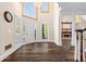 Elegant foyer featuring hardwood floors, fireplace view, and ample natural light at 971 Ashebrooke Ne Ct, Marietta, GA 30068