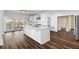 Open-concept kitchen with a large island and access to the outdoor deck at 971 Ashebrooke Ne Ct, Marietta, GA 30068