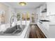 Bright kitchen with stainless steel faucet, white countertops and a stylish backsplash at 971 Ashebrooke Ne Ct, Marietta, GA 30068