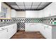 Charming kitchen featuring white cabinets, modern countertops and hardwood floors at 971 Ashebrooke Ne Ct, Marietta, GA 30068