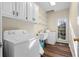 Laundry room with sink, washer, dryer, and storage at 971 Ashebrooke Ne Ct, Marietta, GA 30068