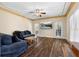 Cozy living room with hardwood floors, comfortable seating and a large-screen TV at 971 Ashebrooke Ne Ct, Marietta, GA 30068