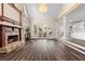 Spacious living room featuring a fireplace, hardwood floors, and bright windows at 971 Ashebrooke Ne Ct, Marietta, GA 30068