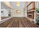 Open-concept living room with fireplace, hardwood floors and kitchen access at 971 Ashebrooke Ne Ct, Marietta, GA 30068