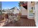 Cozy outdoor patio with outdoor seating, wooden floors, and a red wooden fence at 971 Ashebrooke Ne Ct, Marietta, GA 30068