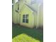 View of home's rear exterior with classic siding and a well-maintained yard at 2581 Star Ln, Decatur, GA 30034
