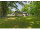 Large, grassy backyard that offers plenty of space for outdoor activities and gardening at 525 Baker Nw Cir, Atlanta, GA 30318