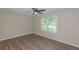 Spacious bedroom with ceiling fan and wood-look flooring at 525 Baker Nw Cir, Atlanta, GA 30318