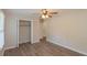 Bright bedroom with closet, fan and light, and wood-look flooring at 525 Baker Nw Cir, Atlanta, GA 30318