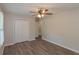 Neutral bedroom with closet, fan and light, and wood-look flooring at 525 Baker Nw Cir, Atlanta, GA 30318