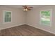 Bright bedroom with two windows and wood-look flooring at 525 Baker Nw Cir, Atlanta, GA 30318
