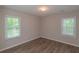 Bright bedroom with wood-look flooring and white trim throughout at 525 Baker Nw Cir, Atlanta, GA 30318