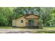 Charming single-story home with a cozy front porch and a bright blue front door at 525 Baker Nw Cir, Atlanta, GA 30318
