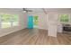 Living room with access to the back porch and updated kitchen at 525 Baker Nw Cir, Atlanta, GA 30318