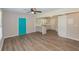 Open-concept living space with blue door and view of the kitchen at 525 Baker Nw Cir, Atlanta, GA 30318