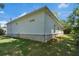 The house exterior shows the white siding and brick foundation with lush green lawn surrounding it at 614 Glendale Rd, Scottdale, GA 30079