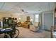 Spacious finished basement with seating, a workspace, and a door to the exterior at 809 Longbranch Ln, Douglasville, GA 30134