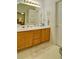 Bright bathroom with double vanity, seashell accents, and ample storage at 809 Longbranch Ln, Douglasville, GA 30134
