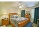 Cozy bedroom featuring a ceiling fan, comfortable bed with pillows, and matching nightstands at 809 Longbranch Ln, Douglasville, GA 30134