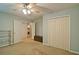 Neutral bedroom featuring double closets and an adjoining room at 809 Longbranch Ln, Douglasville, GA 30134