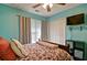 Comfortable bedroom features a TV, double closet, and natural light at 809 Longbranch Ln, Douglasville, GA 30134
